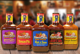 Line up of 5 of Famous Dave's BBQ Sauces, from left to right it is Sweet & Zesty, Texas Pit, Rich & Sassy, Devil's Spit, and Georgia Mustard
